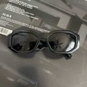 Versace sunglasses in black and gold